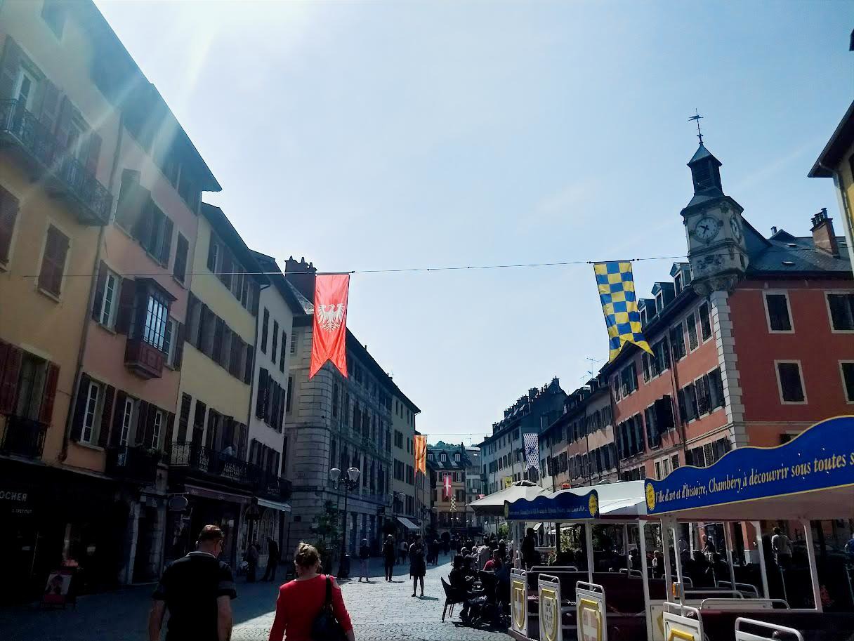 Pastel sunset over Lake Annecy with boats anchored nearby