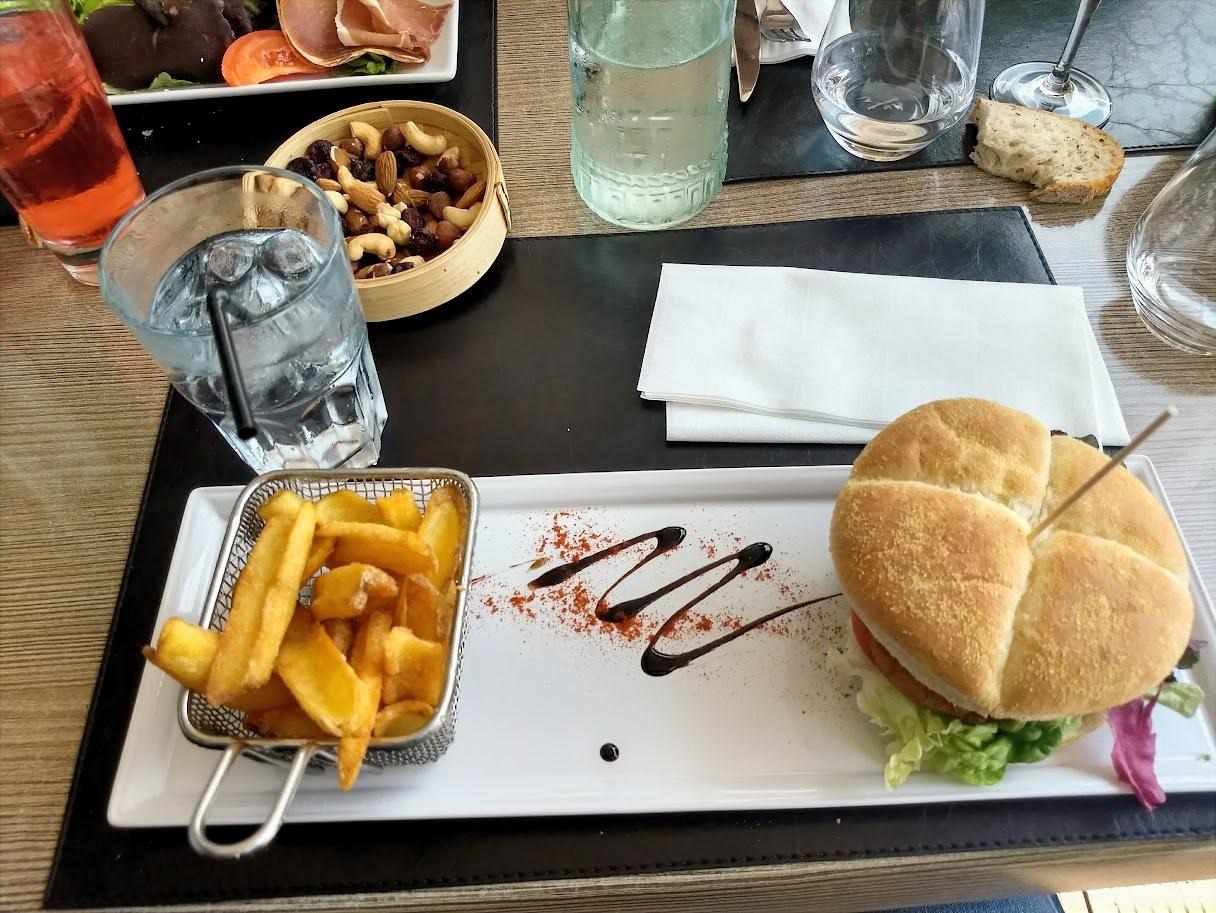 Pastel sunset over Lake Annecy with boats anchored nearby