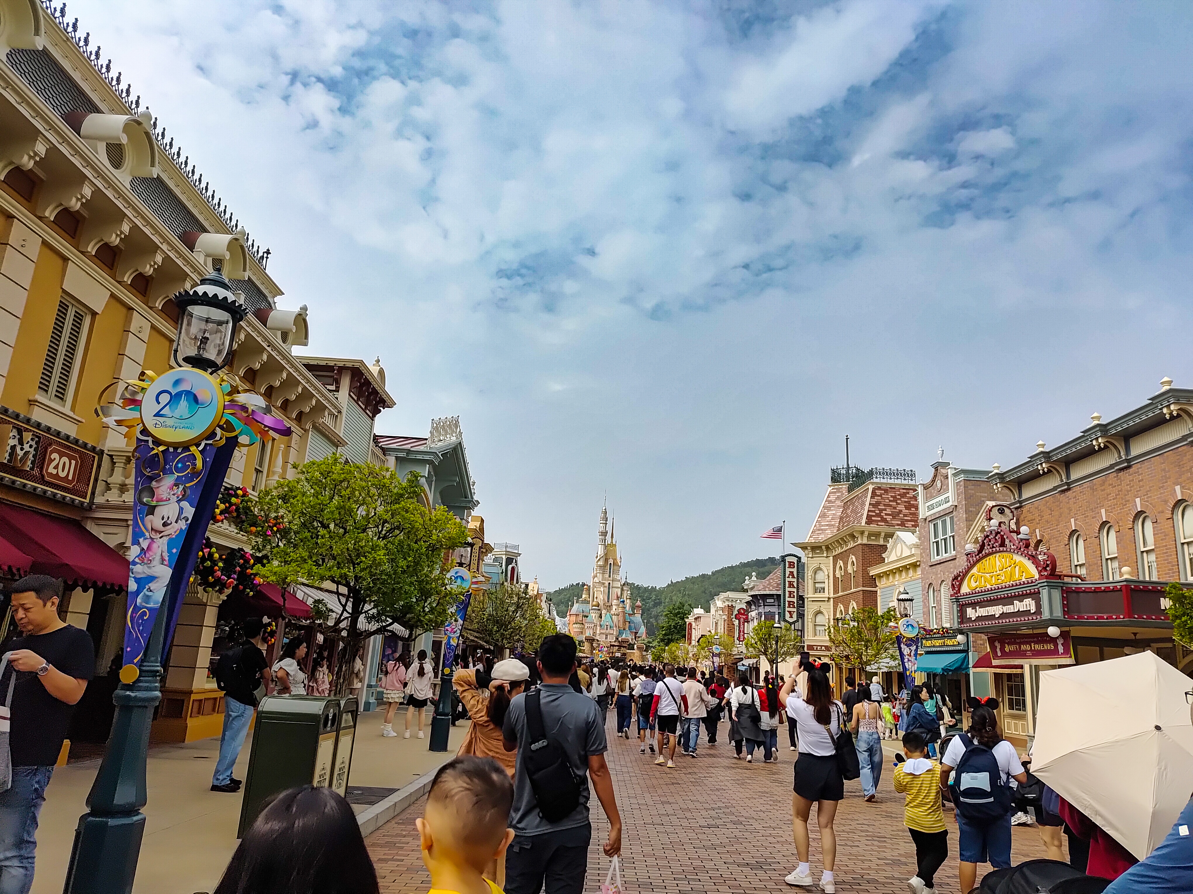 Crowds walking down Main Street at Hong Kong Disneyland