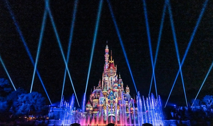 Hong Kong Disneyland castle glowing at night
