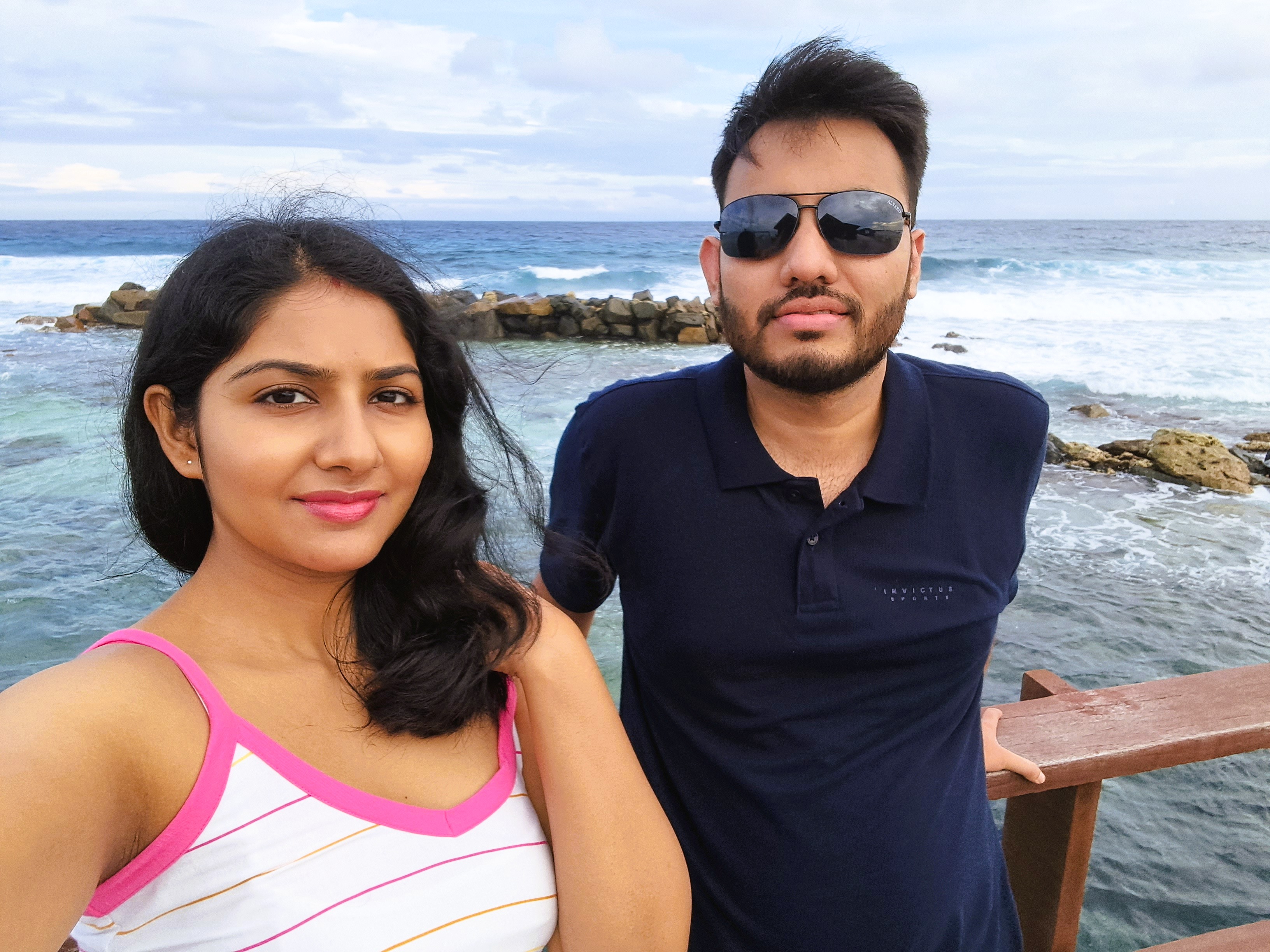 Couple snorkeling above coral reef